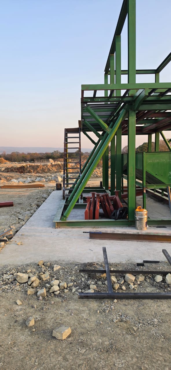 Chrome wash plant — access stairs and side frame at dusk