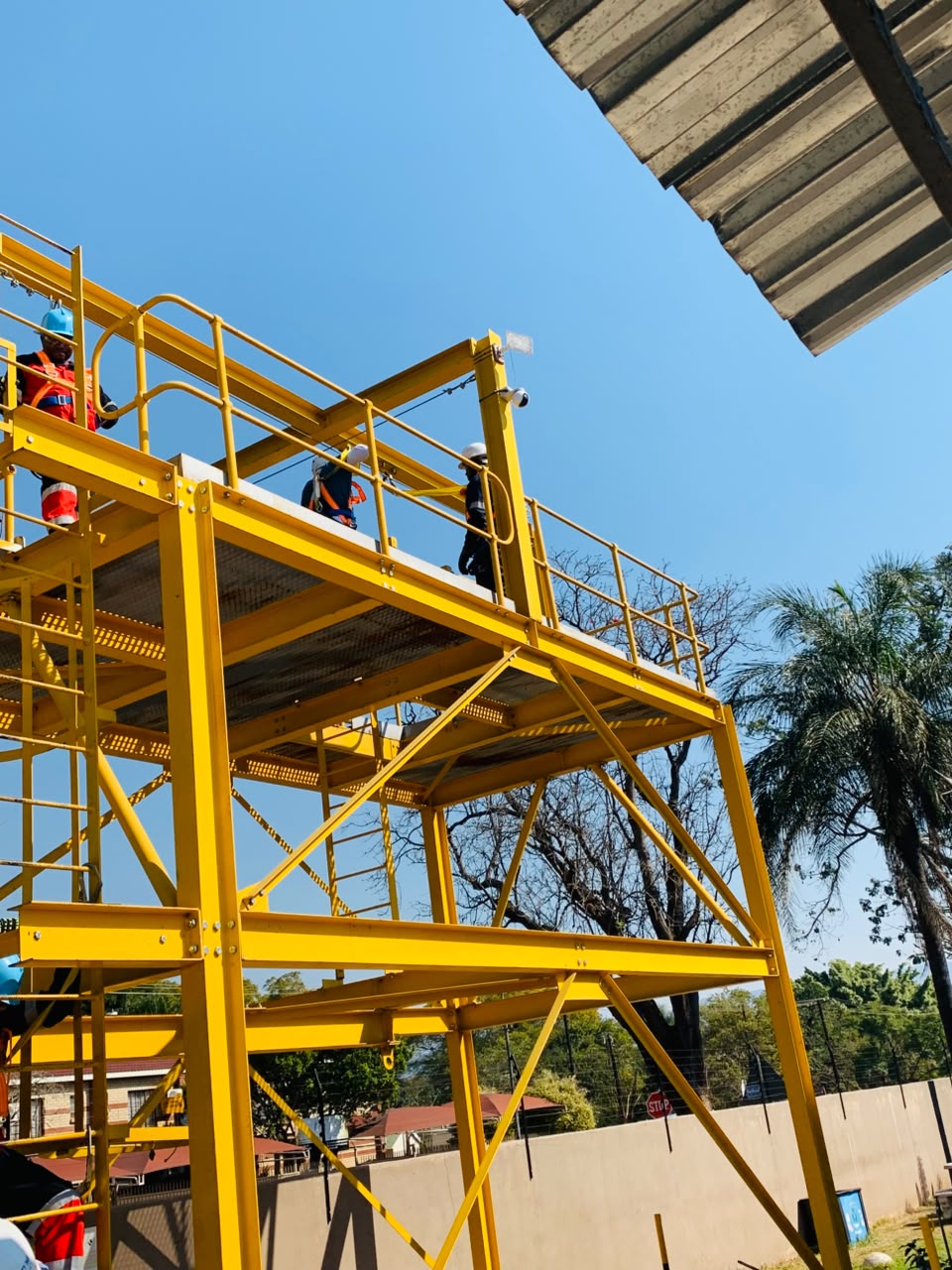 Makurung team practising safe access on an elevated yellow work platform