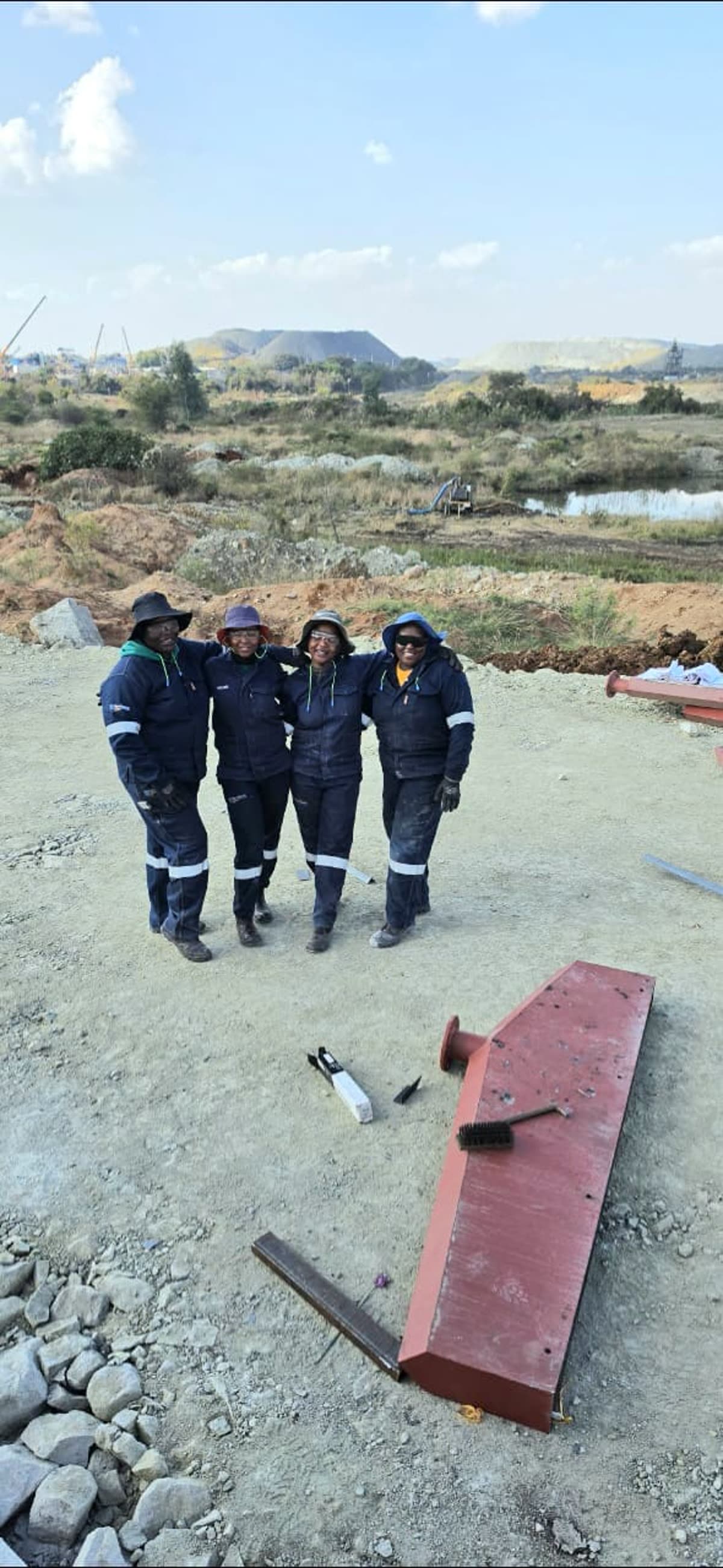 Four female welding students from Waterberg College on-site
